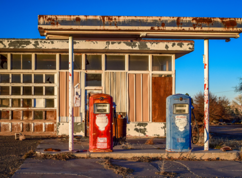 old gas station with red and blue pump out front
