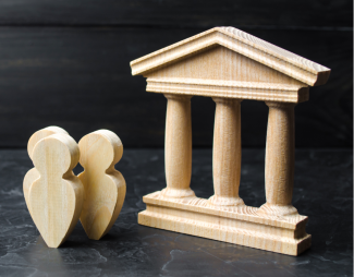 Wooden play toys representing government building and people