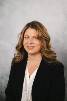 Portrait of a woman with a gray background